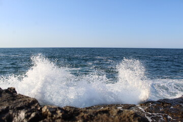 waves crashing on rocks
