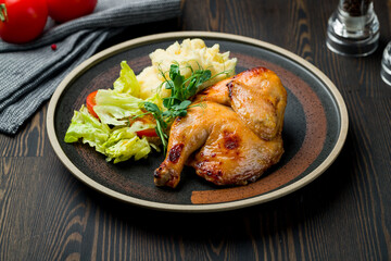 Chinese fried chicken with mashed potatoes on dark wooden table