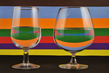 Drink water refraction in Wineglass closeup with colorful background