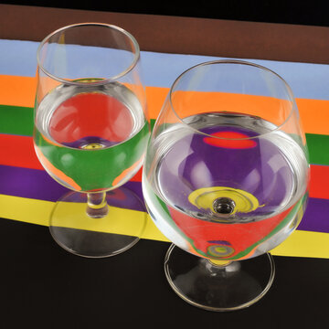 Two Wineglasses closeup with colorful background