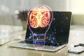Fototapeta na wymiar Creative light bulb with human brain hologram on modern laptop background, artificial Intelligence and neural networks concept. Multiexposure