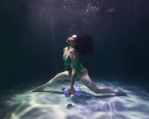 it is hard for a girl to lift dumbbells under water