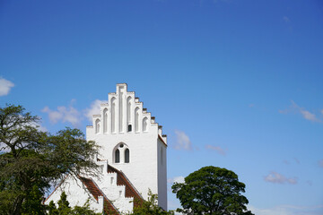 Typical whitewashed Danish Church on Zealand - 450099093
