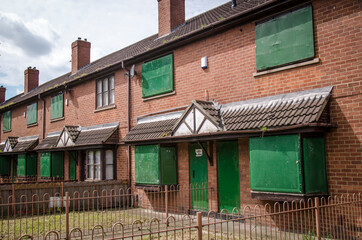 Boarded-up terrace houses awaiting refurbishment local authority housing estate in the North of...