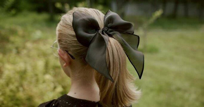 head accessory portrait cute teenage girl with black bow and black dress