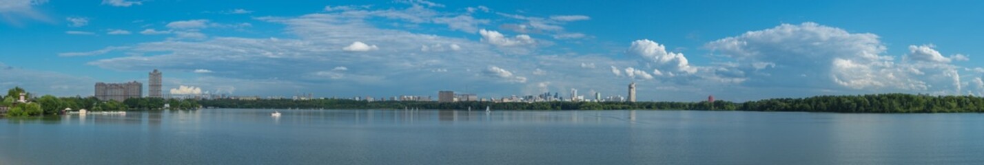 Wide panoramic view of the Stroginsky Bay of Moskva River and urban cityscape of the Shchukino district, Moscow photo