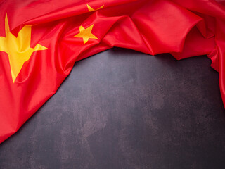 Part of the China flag on vintage background. Top view. Space for text