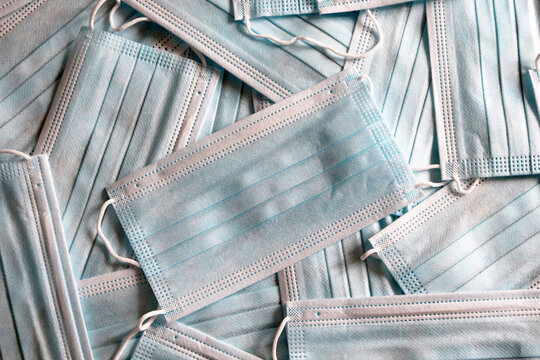 Many protective blue face masks - Powered by Adobe