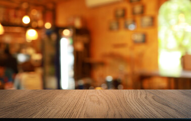 Wood table top in front of abstract blurred background. Empty wooden table space for text marketing promotion. blank wood table surface copy space