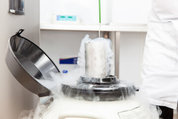 Liquid nitrogen cryogenic tank at life sciences laboratory: Steam of nitrogen created from liquid...