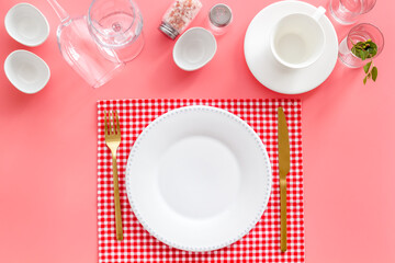 Dinnerware set with view from above - plate with cutlery and napkin