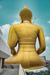 Giant golden buddha statue of Dhammakaya Thep Mongkol Buddha in construction site located at Wat...