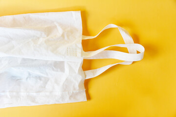 White synthetic bag on color background, no plastic,eco friendly concept