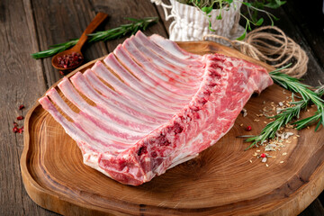 lamb chops raw ribs with seasonings prepared for grilling. Lamb rack meat for the in the butcher