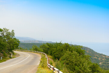 Serpentines on a mountain road with a beautiful view of the sea