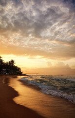 Naklejka na ściany i meble Tropical beach at sunrise.