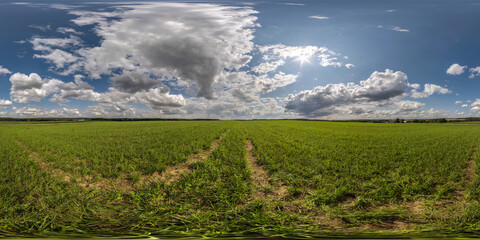 Fototapeta na wymiar full seamless spherical hdri panorama 360 among green farming fields in summer day with awesome clouds in equirectangular projection, ready for VR AR virtual reality content