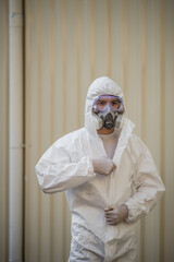Young man wearing PPE and Protectiion mask preparing remove covid-19