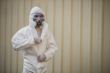 Young man wearing PPE and Protectiion mask preparing remove covid-19