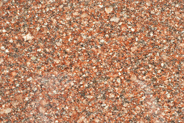 Texture of yellow, red and orange marble. Stone tile with natural pattern. Marble pavement closeup.