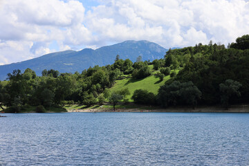 Tenno Italy August 2021 View of Lake Tenno and the mountains in beautiful weather with blue sky 