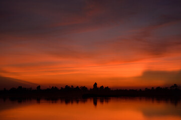 Fototapeta na wymiar The beautiful nature with golden lake in sunset