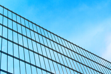 Fototapeta na wymiar mesh fence against the blue sky