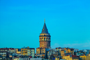 selective focus, magnificent galata tower joins the unique color gamut of the sunset. orange galata...