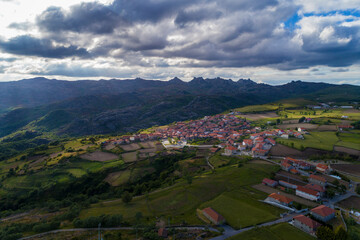 Fototapeta na wymiar Aerial view of the traditional village of Pitoes das Junias and the surrounding agricultural fields, in the Norhern Region of Portugal