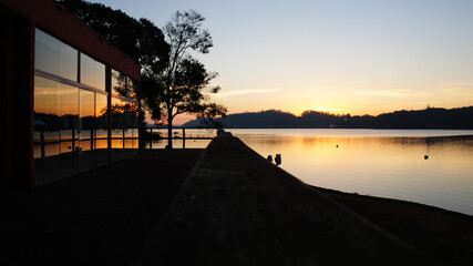 Calm sunset on a dam pier.
