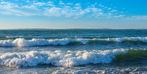 Naklejka na ściany i meble White waves rolling in and splashing on the beach on Cape Cod