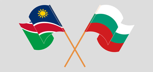Crossed and waving flags of Namibia and Bulgaria
