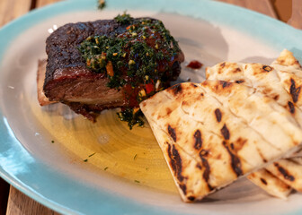 grilled ribs with pita bread, a dish from the restaurant