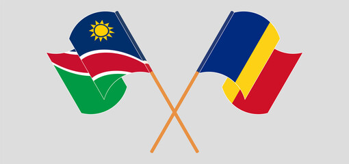 Crossed and waving flags of Namibia and Romania