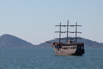 pirate ship in the blue sea in a sunny day in Florianópolis, Santa Catarina, Brazil