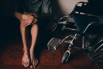 Lonely disabled man and wheelchair in the house, Depression occurs in people with disabilities who are alone at home.