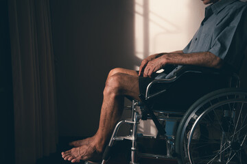 Fototapeta na wymiar Lonely disabled man on wheelchair in the house, Depression occurs in people with disabilities who are alone at home.