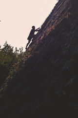 A climber climbing a mountain