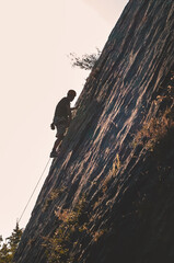 A climber climbing a mountain