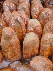 corn buns with cheese in a supermarket basket 