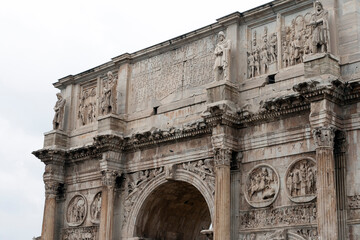 Fototapeta na wymiar Arch of Constantine on a cloudy summer day in Rome