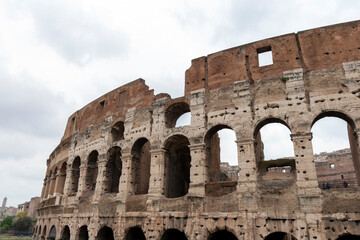 Naklejka premium The Colosseum on a cloudy summer day in Rome