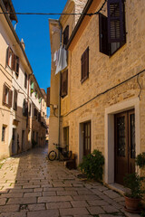 Fototapeta premium A quiet back street in the historic medieval coastal town of Porec in Istria, Croatia 