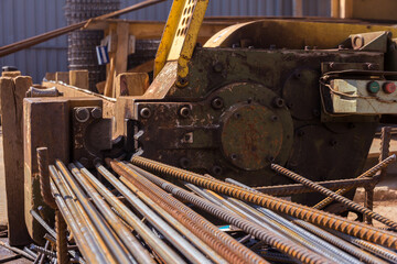 Reinforcement cutting machine. Equipment for metal processing at a construction site. Preparation of steel rods for concreting. Metal cutting