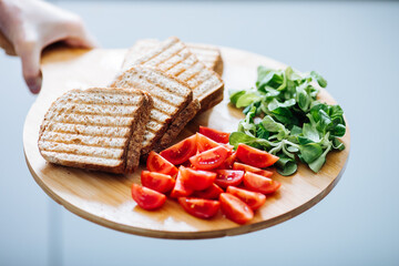 Toast with cherry tomatoes and lettuce 
