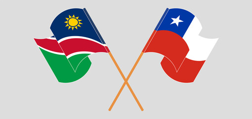 Crossed and waving flags of Namibia and Chile