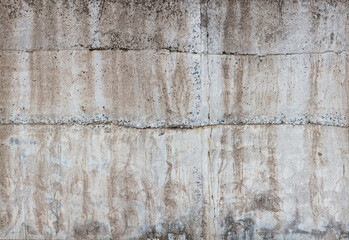 Concrete sunny wall with drips