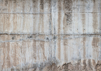 Concrete sunny wall with drips