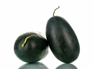 Two ripe dark green watermelons, close-up, isolated on white.