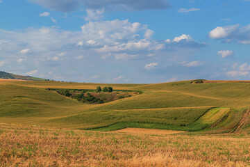 Beautiful wavy landscape of Moravian Tuscany in the Czech Republic. Blue sky and clouds.